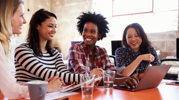 female employees in a meeting female employees in a meeting discussing how to keep their career on track