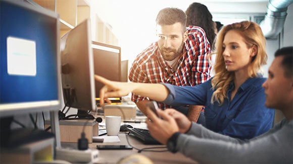 three people working on pc three-people-working-on-pc