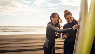 Women checking surfboards 